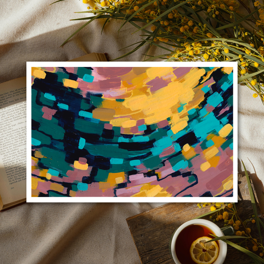 Colorful abstract painting on a textured surface with a cup of tea and flowers.