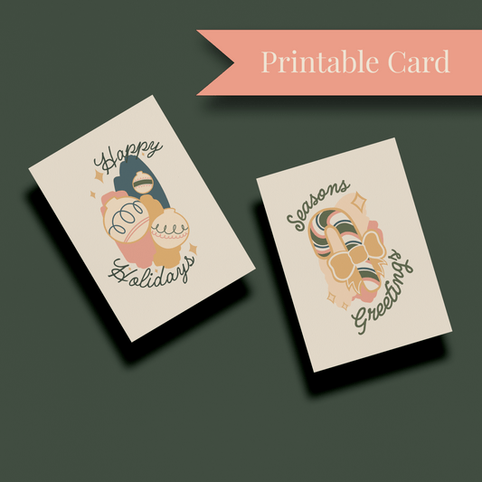 Two holiday greeting cards float above a dark, neutral background. A flag reading "Printable Card" is on the right.